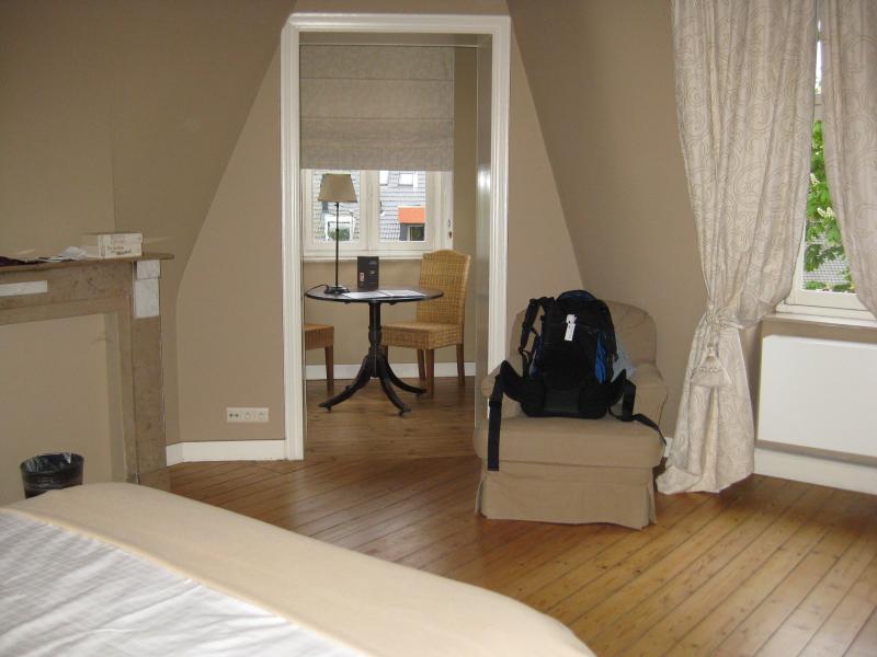 A backpack on a chair in a random room.